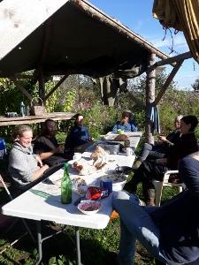 volunteers sitting round a table eating