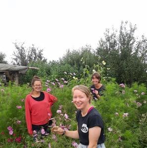 trainees smiling in flower area