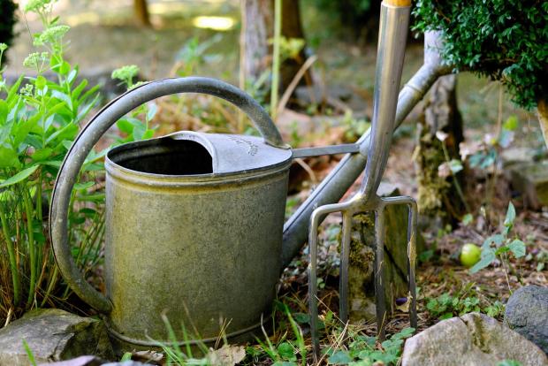 watering can and fork