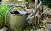 watering can and fork