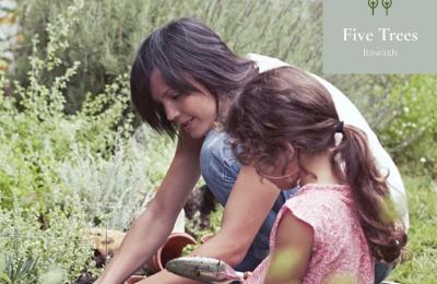 image of parent and child gardening