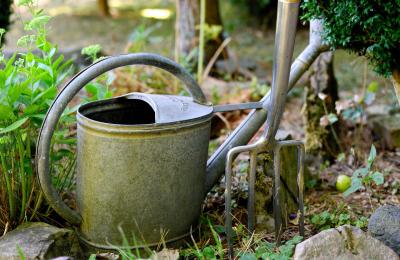 watering can and fork